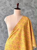 Yellow Chanderi silk fabric featuring a floral print.