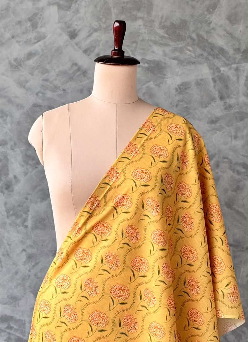 Yellow Chanderi silk fabric featuring a floral print.