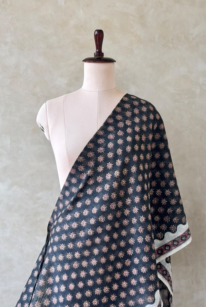 Black Mughal Chanderi fabric featuring floral prints and traditional-inspired patterns.