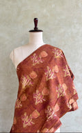 Brick red and peach Jaipur cotton fabric with floral block prints in pink, magenta and golden tones.