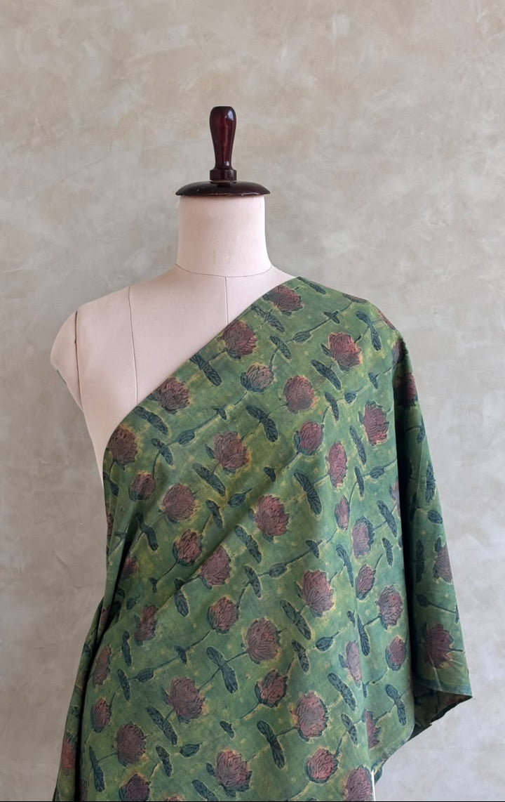 Forest green Jaipur cotton fabric featuring a floral print.