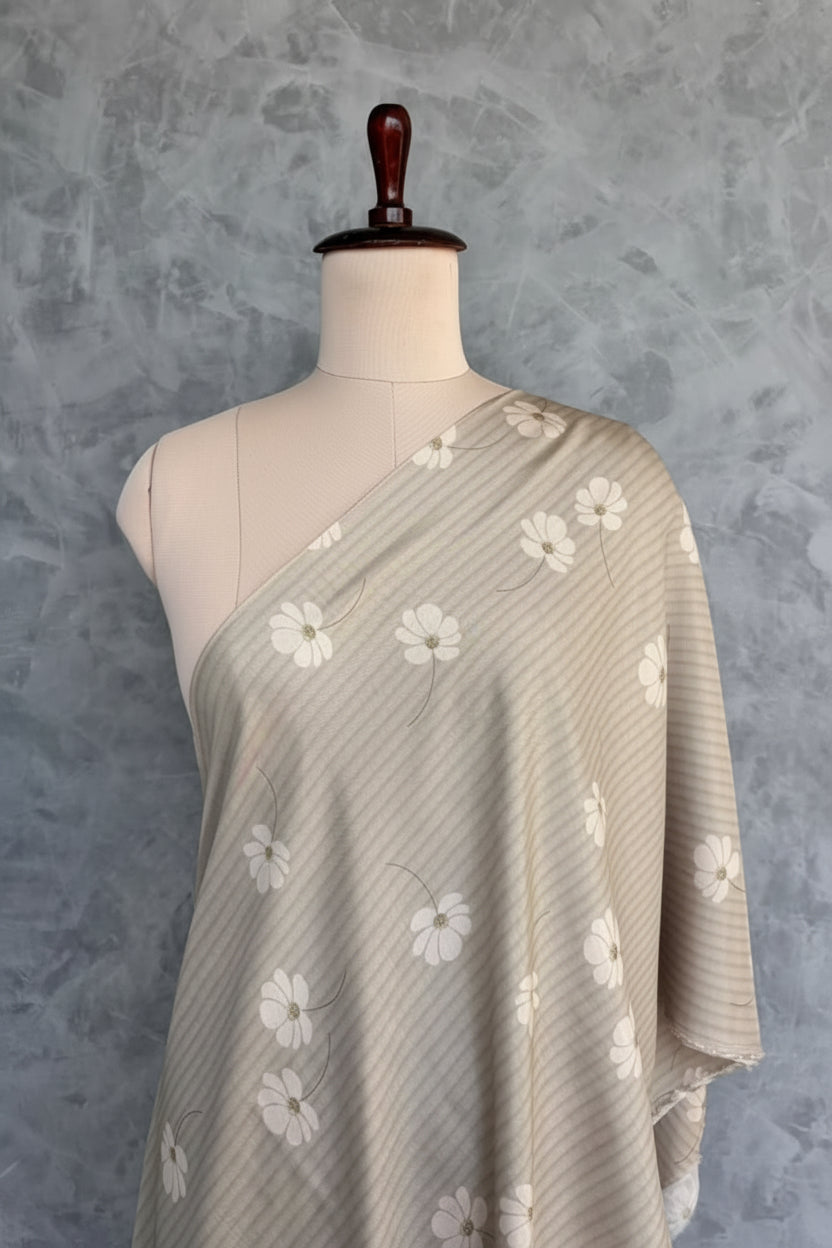 Beige muslin fabric with white daisy floral prints and subtle self-stripes.