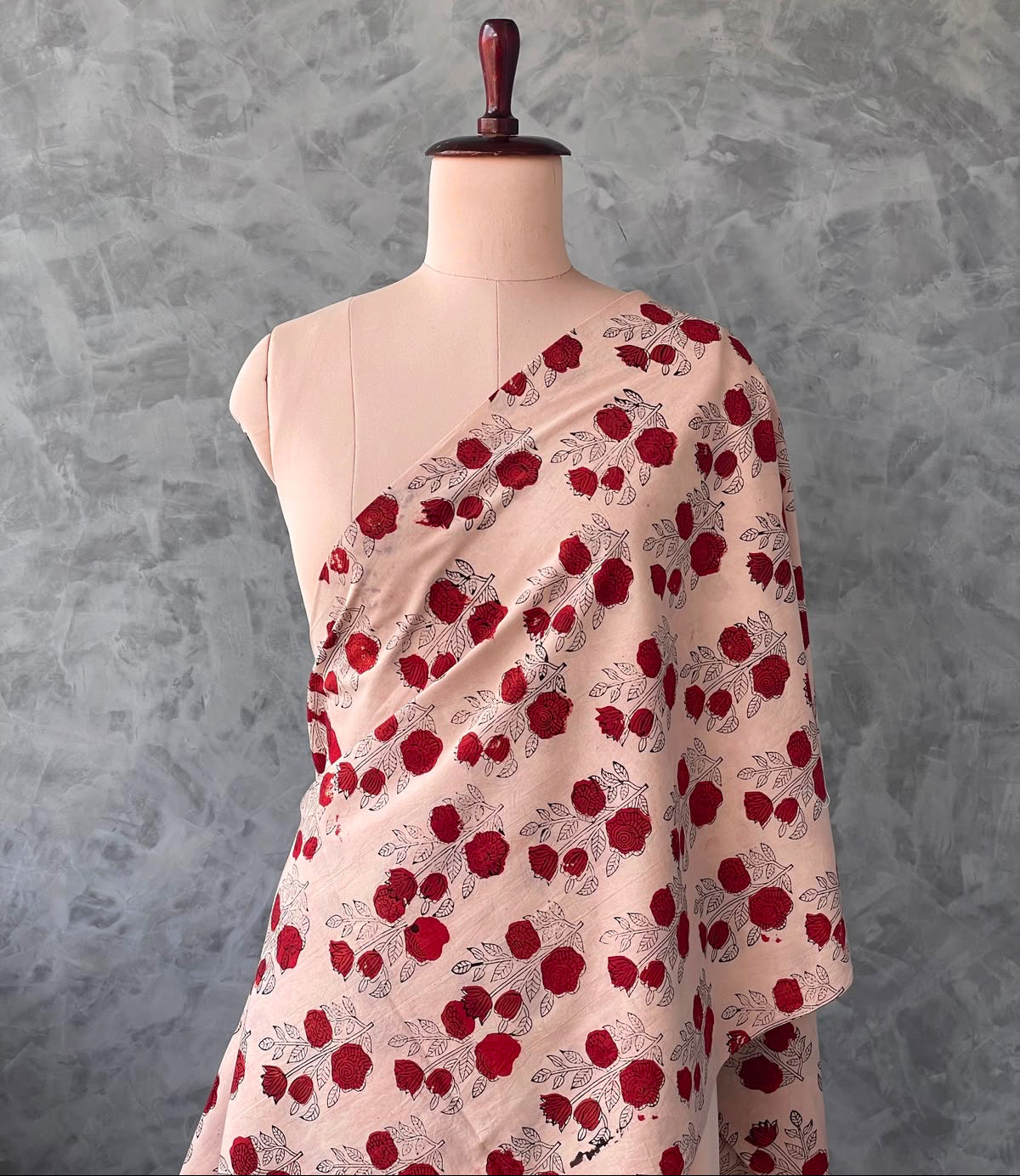 Rosy cream cotton fabric featuring a traditional Bagru print.