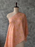 Light salmon Banarasi silk Chanderi fabric featuring a delicate floral print.