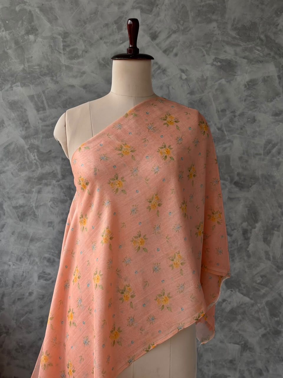 Light salmon Banarasi silk Chanderi fabric featuring a delicate floral print.